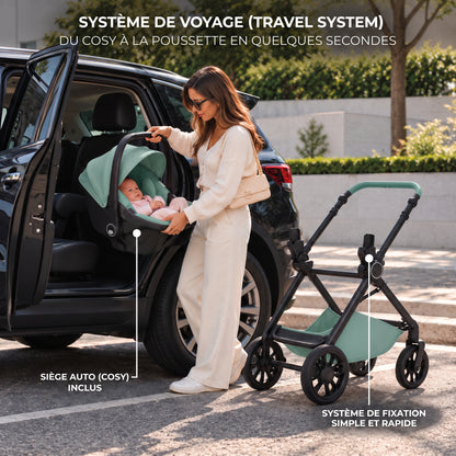 Maman installant le cosy vert émeraude de la poussette 3 en 1 Signature Camille dans une voiture, châssis noir à côté