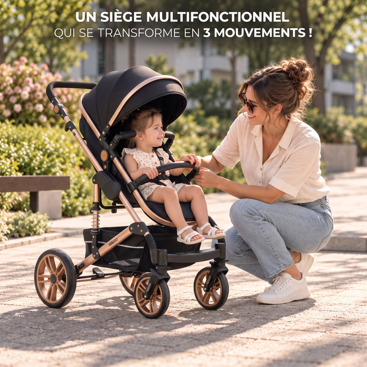 Poussette 3 en 1 Essentielle Prestige noir doré en mode assise, enfant assis face à sa maman accroupie dans un parc
