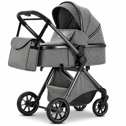 Poussette 3-en-1 Essentielle Ivoire en coloris gris, nacelle montée sur châssis noir, vue de profil sur fond blanc