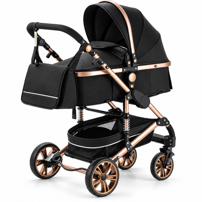Poussette 3-en-1 Essentielle Prestige noire à finitions dorées, nacelle montée, vue de trois quarts sur fond blanc